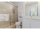 Bathroom featuring tiled shower with glass door and vanity at 246 Kimberly Point Dr, Davenport, FL 33837