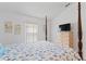 Bright bedroom with four poster bed and neutral walls at 246 Kimberly Point Dr, Davenport, FL 33837