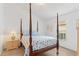Cozy bedroom with four poster bed and neutral walls at 246 Kimberly Point Dr, Davenport, FL 33837