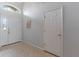 Bright entryway with tiled floor, high ceiling, and decorative wall art at 246 Kimberly Point Dr, Davenport, FL 33837
