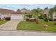 Charming single-Gathering home featuring a well-manicured lawn and attached two-car garage at 246 Kimberly Point Dr, Davenport, FL 33837