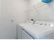 Convenient laundry room features both a washer and dryer with overhead storage shelf at 246 Kimberly Point Dr, Davenport, FL 33837