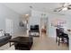 Open-concept living space with tile flooring, neutral walls, and a view of the adjacent bedroom at 246 Kimberly Point Dr, Davenport, FL 33837