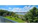 Picturesque lake view with vibrant greenery and kayaks stored nearby, creating a tranquil outdoor space at 593 Lake Wildmere Cv, Longwood, FL 32750