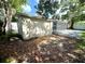 The yard includes space for gardening and pool access at 920 S Solandra Dr, Orlando, FL 32807