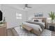 Cozy bedroom with natural light, wood-look floors, and a comfortable king-size bed at 920 S Solandra Dr, Orlando, FL 32807