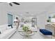 Inviting living room with white walls, modern furnishings and stainless steel kitchen appliances at 920 S Solandra Dr, Orlando, FL 32807