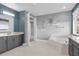 This bathroom features dual vanities with granite countertops, a soaking tub, and modern fixtures at 13016 Shady Retreat Loop, Clermont, FL 34711