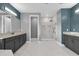 Modern bathroom with gray cabinetry, granite countertops, and a glass enclosed shower at 13016 Shady Retreat Loop, Clermont, FL 34711