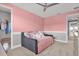 Comfortable bedroom with a daybed, ceiling fan and large closet creates a relaxing and inviting atmosphere at 13016 Shady Retreat Loop, Clermont, FL 34711