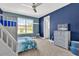 bedroom with twin bed and built-in dresser at 13016 Shady Retreat Loop, Clermont, FL 34711