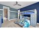 Fun ' bedroom offers bunk beds, playful decor, and a blue accent wall creating an imaginative and cozy space at 13016 Shady Retreat Loop, Clermont, FL 34711