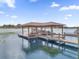 Spacious boat dock on the lake with seating area at 13016 Shady Retreat Loop, Clermont, FL 34711