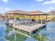 Covered boat lift with pontoon boat at 13016 Shady Retreat Loop, Clermont, FL 34711