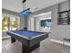 Game room featuring a pool table, dining area, and plenty of natural light at 13016 Shady Retreat Loop, Clermont, FL 34711