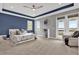 Serene main bedroom with tray ceiling, balcony access, and water views at 13016 Shady Retreat Loop, Clermont, FL 34711