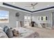 Bright and open main bedroom featuring balcony access and neutral decor at 13016 Shady Retreat Loop, Clermont, FL 34711