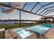 Beautiful pool and spa area with views of the lake, perfect for enjoying sunsets at 13016 Shady Retreat Loop, Clermont, FL 34711