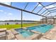 Backyard retreat with a refreshing pool, spa, and a view of the lake at 13016 Shady Retreat Loop, Clermont, FL 34711