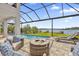 Relaxing pool area with fire pit and lake view at 13016 Shady Retreat Loop, Clermont, FL 34711