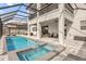 Resort-style pool and spa with covered patio at 13016 Shady Retreat Loop, Clermont, FL 34711