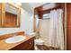 Bathroom featuring wood paneled walls and floors at 2459 Adelia Blvd, Deltona, FL 32725