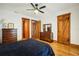 Bedroom featuring hardwood floors and multiple wood trimmed doors at 2459 Adelia Blvd, Deltona, FL 32725