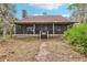 Exterior elevation of home with a covered porch featuring a brick path and staircase at 2459 Adelia Blvd, Deltona, FL 32725