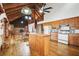Open kitchen with wood cabinets, island, and appliances at 2459 Adelia Blvd, Deltona, FL 32725