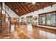 Open-concept living space with high ceilings, wood floors, spiral staircase, and natural light at 2459 Adelia Blvd, Deltona, FL 32725