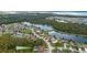 Community aerial view showcasing a scenic neighborhood, lakes, and lush greenery at 2717 Eagle Cliff Dr, Kissimmee, FL 34746