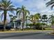 Exterior view of Millennium Palms Condominiums buildings surrounded by palm trees at 4743 S Texas Ave # 4743B, Orlando, FL 32839