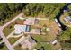 Aerial view of homes with pools near the river with property line in red at 12009 Eagle Point Ct, Leesburg, FL 34788