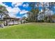 Enjoy this spacious backyard, offering a boat dock and lush green lawn at 12009 Eagle Point Ct, Leesburg, FL 34788