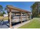 A covered boat dock with a boat lift and a boat ready for the water at 12009 Eagle Point Ct, Leesburg, FL 34788