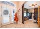 Inviting foyer with large windows, barn doors, and neutral tile flooring at 12009 Eagle Point Ct, Leesburg, FL 34788