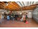 A garage filled with tools, equipment, bikes, and storage shelves at 12009 Eagle Point Ct, Leesburg, FL 34788