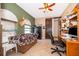 A well-lit office area features tile flooring, a barn door, and stylish decor at 12009 Eagle Point Ct, Leesburg, FL 34788