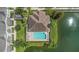 Overhead view of the community pool, with nearby properties and lake at 1349 Mill Stream Ln, Winter Springs, FL 32708