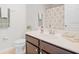 Bathroom featuring a vanity with a single sink, white countertop, a decorative mirror, and a shower at 1349 Mill Stream Ln, Winter Springs, FL 32708