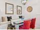 Cozy dining area with contemporary furniture, stylish lighting, and decorative wall mirrors, offering a welcoming ambiance at 1349 Mill Stream Ln, Winter Springs, FL 32708