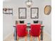 Inviting dining space enhanced by stylish chairs, modern lighting, and decorative wall art, with tile flooring throughout at 1349 Mill Stream Ln, Winter Springs, FL 32708