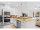 Bright kitchen with stainless steel appliances, granite counters, and an open layout at 1349 Mill Stream Ln, Winter Springs, FL 32708