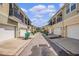 Exterior street view of townhomes with front-entry garages and well-kept landscaping at 1349 Mill Stream Ln, Winter Springs, FL 32708