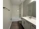 Stylish bathroom with a tub-shower, white subway tile, and a modern vanity at 2564 Hawks Overlook Pl, Oviedo, FL 32765