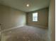 A bedroom features a single window for natural light and neutral walls at 2564 Hawks Overlook Pl, Oviedo, FL 32765