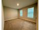 Neutral bedroom with plush carpeting, two windows that provide natural light, and minimalist decor at 2564 Hawks Overlook Pl, Oviedo, FL 32765