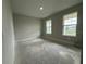 Well-lit bedroom featuring two windows and neutral walls, ready for customization at 2564 Hawks Overlook Pl, Oviedo, FL 32765