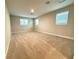 Spacious bonus room featuring neutral carpeting and multiple windows providing ample natural light at 2564 Hawks Overlook Pl, Oviedo, FL 32765