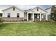 Charming single-Gathering home featuring stone accents, lush green lawn, and a welcoming front porch at 2564 Hawks Overlook Pl, Oviedo, FL 32765